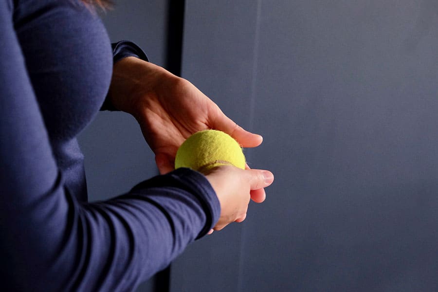 off-body-tennis-ball-in-hands-horiz